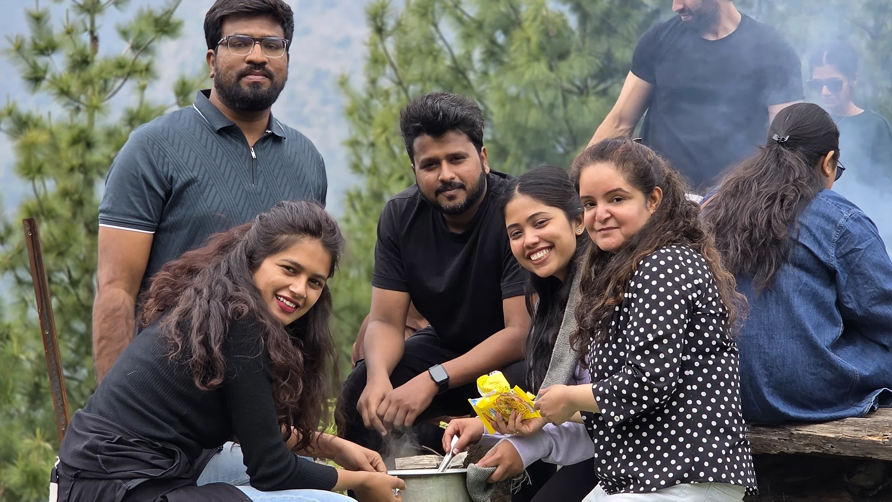 Safar group smiling during the outdoor cooking session