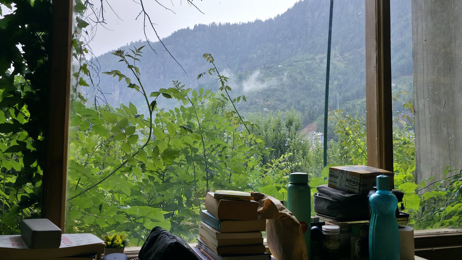 Books beside a wide window at Safar
