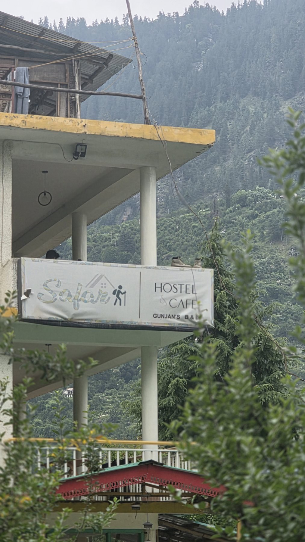 Safar Hostel building in its Old Manali orchard setting